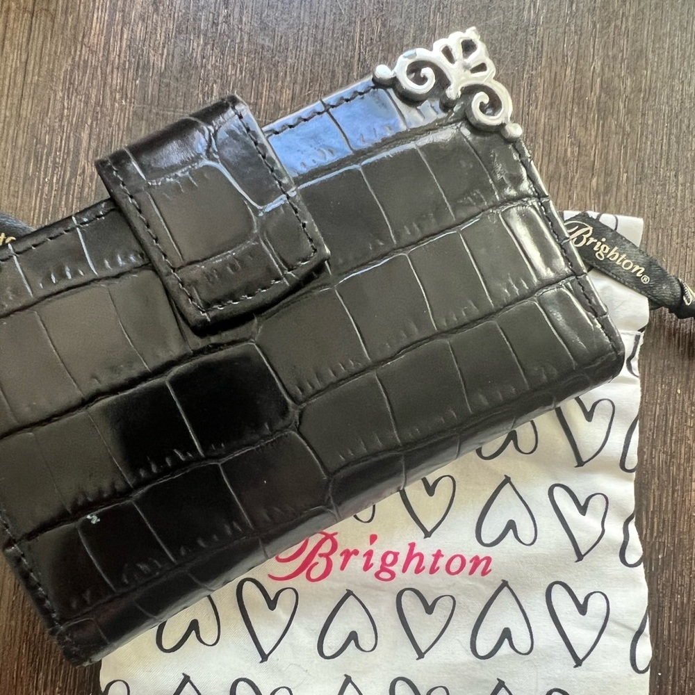 Brighton wallet. So many slots for cards. Real leather.